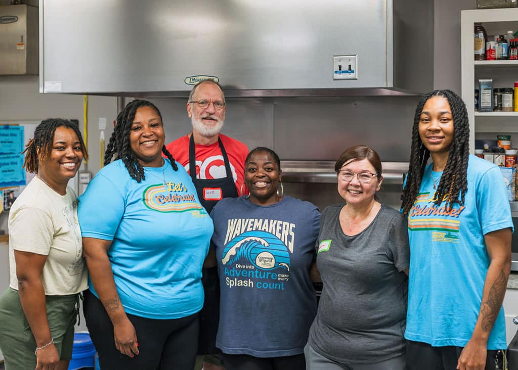 Six people volunteering in kitchen for dinner after church at Common Ground Shreveport
